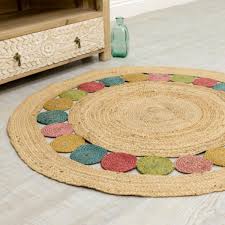 Handwoven jute area rug with a vibrant multicolor inner circle