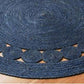 Handcrafted jute mat with a vibrant blue inner circle