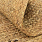 Handcrafted jute rug with a textured braided pattern
