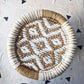 white mudda stool with flower design