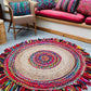 Handcrafted jute rug with colorful cotton accents.