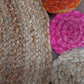 Handmakers Jute and cotton are rug with multiclored outer circle for living room